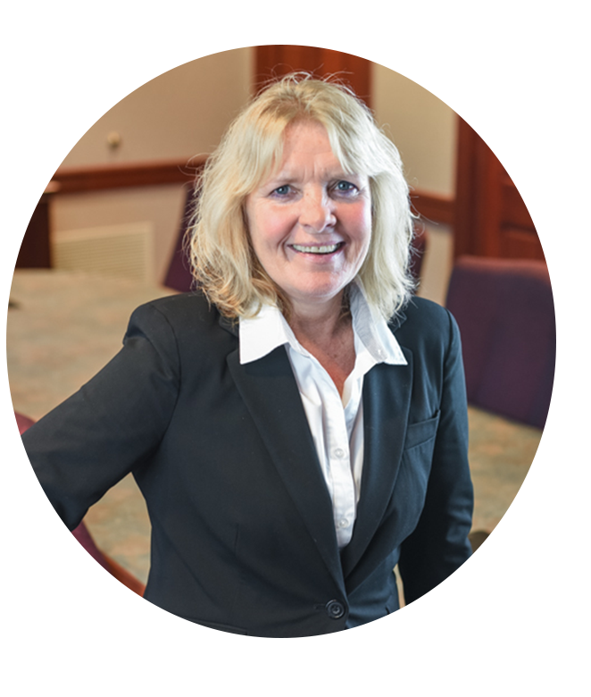 Headshot of Kentucky Farmers Bank AVP/ Loan Officer. She is smiling, and wearing a blazer with a white shirt inside an office.