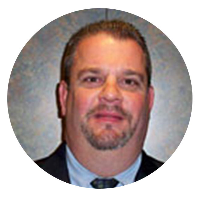 Headshot of Kentucky Farmers Bank Board Member. He is smirking and wearing a suit and tie